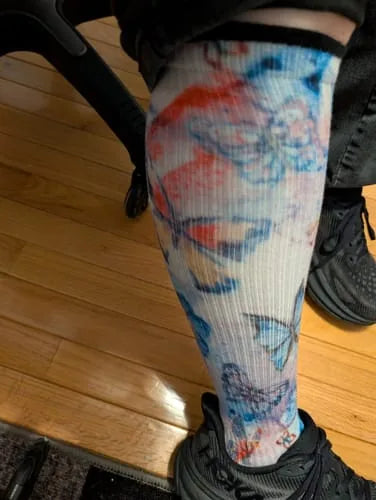 Blue and red watercolour butterfly Compression socks worn while seated